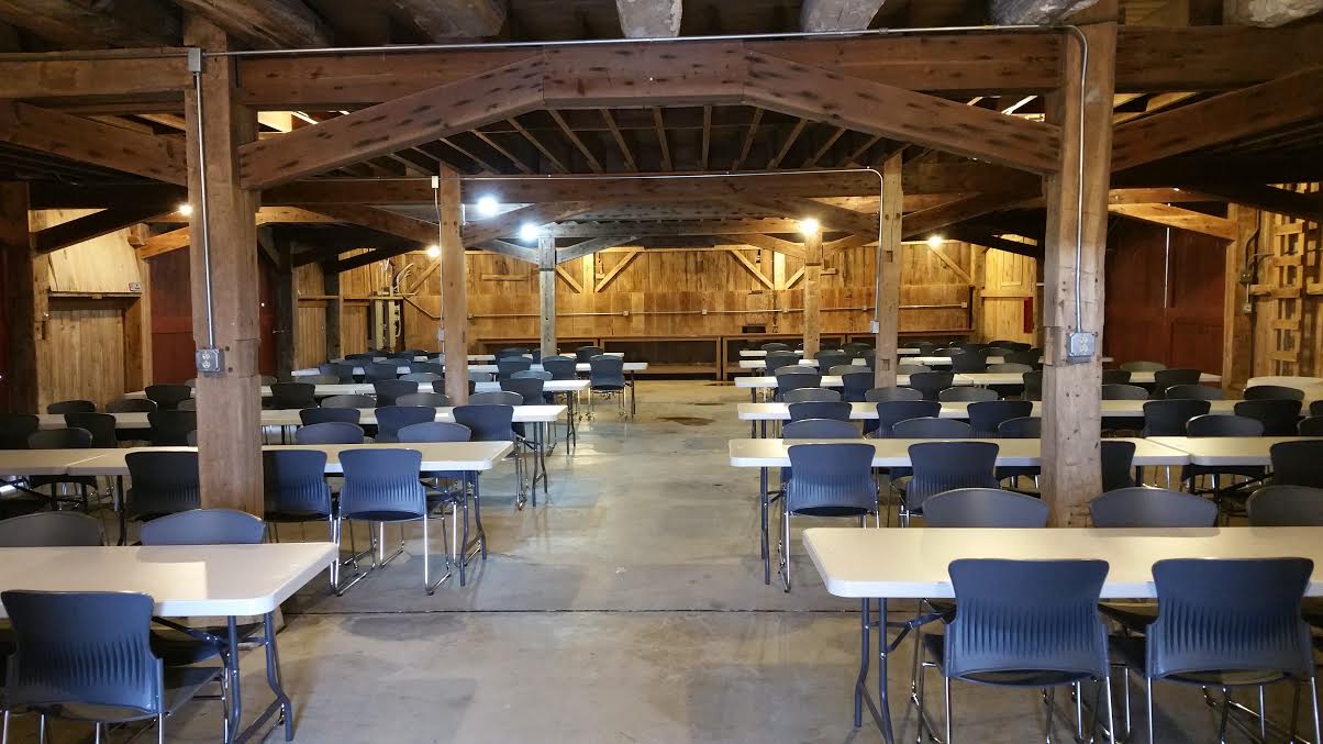 inside Whites Star Barn with tables and chairs set-up